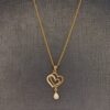 golden heart necklace with white stone