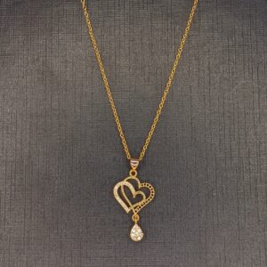 golden heart necklace with white stone